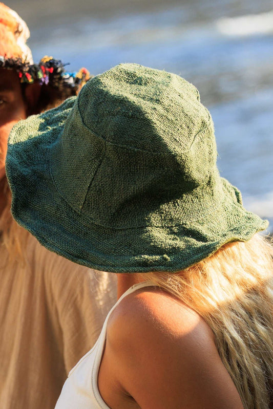Eco-friendly unisex handmade olive green hemp hat with wide brim, perfect for summer travel and everyday wear.