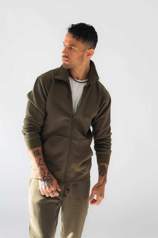 Man wearing olive hemp jacket made of organic cotton and hemp fleece with full zipper and pockets