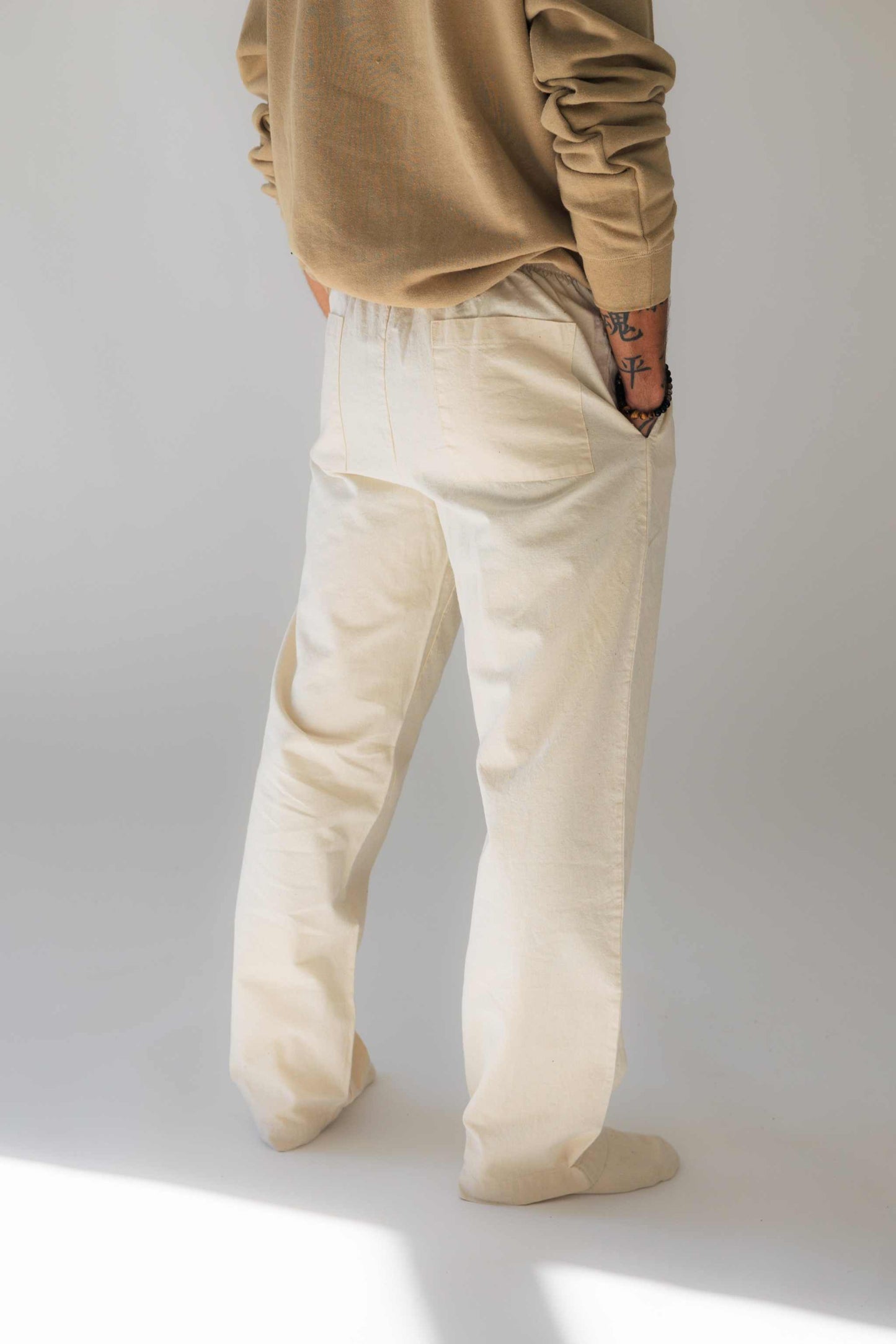 Unisex hemp linen & organic cotton pants in linen white, relaxed fit with elastic waistband, eco-friendly and breathable fabric.