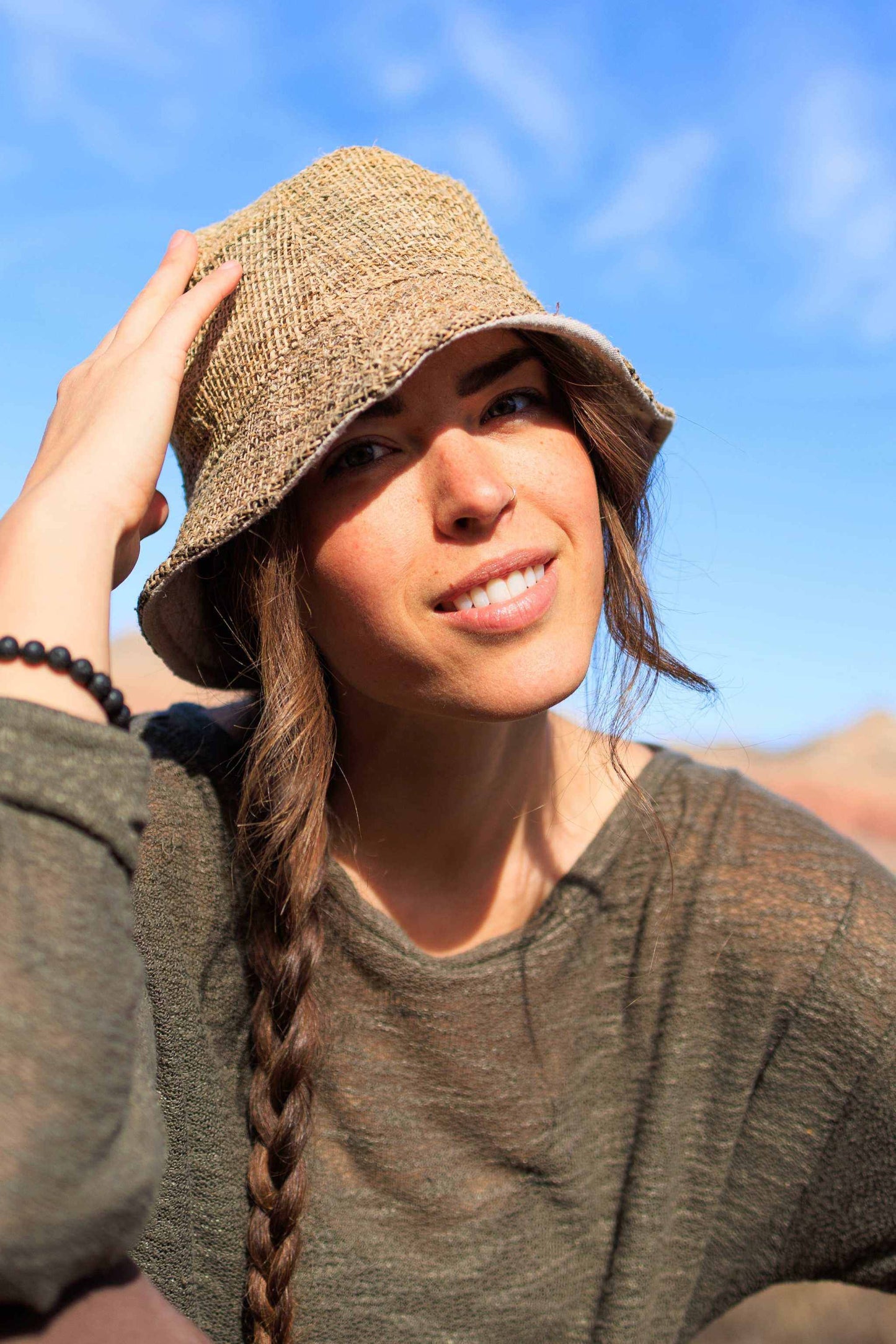 Hemp bucket hat with soft cotton lining, eco-friendly and stylish for summer activities.