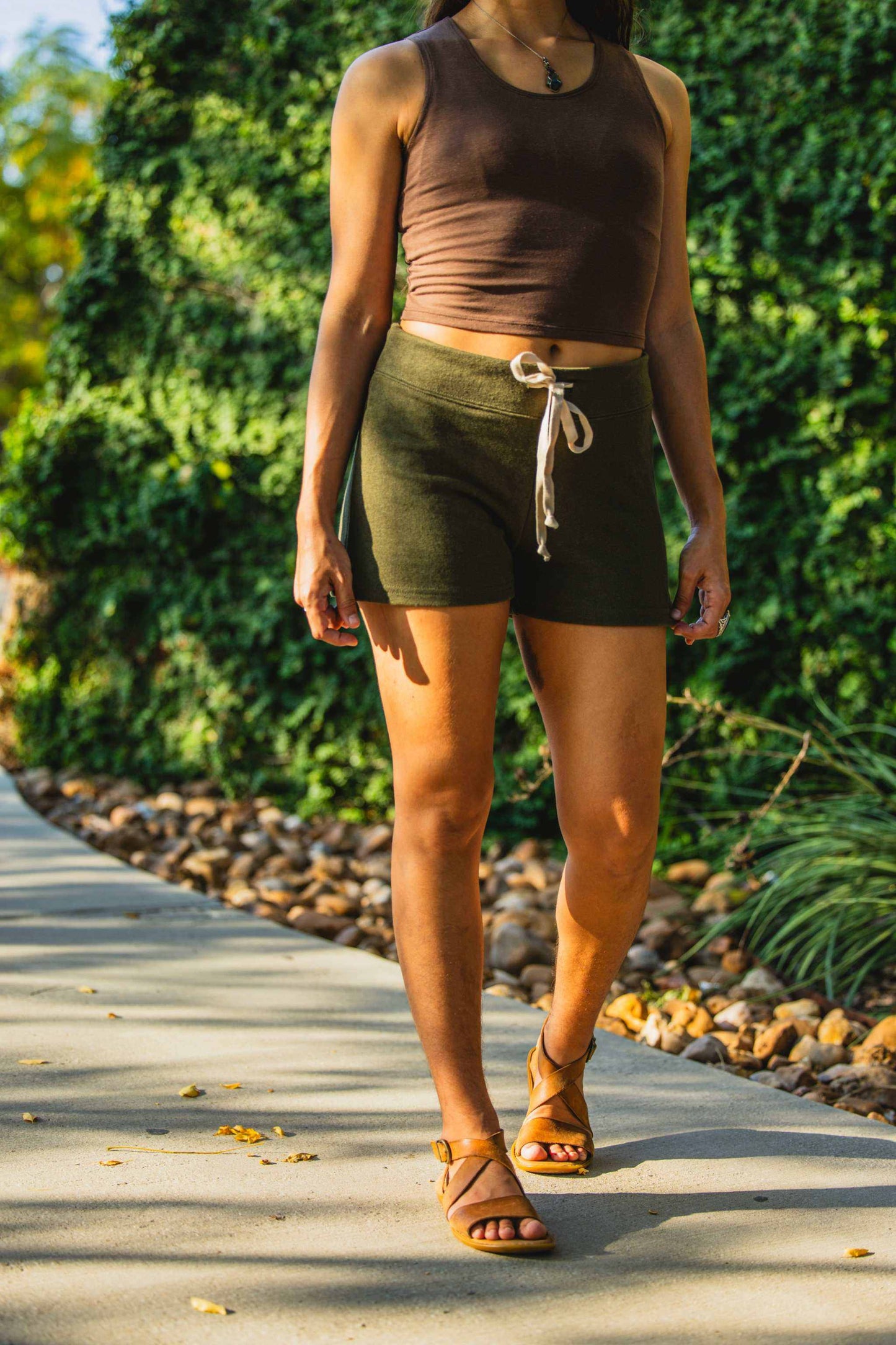 Women's hemp French terry drawstring shorts in olive color, elastic-free waistband, versatile for daily wear.