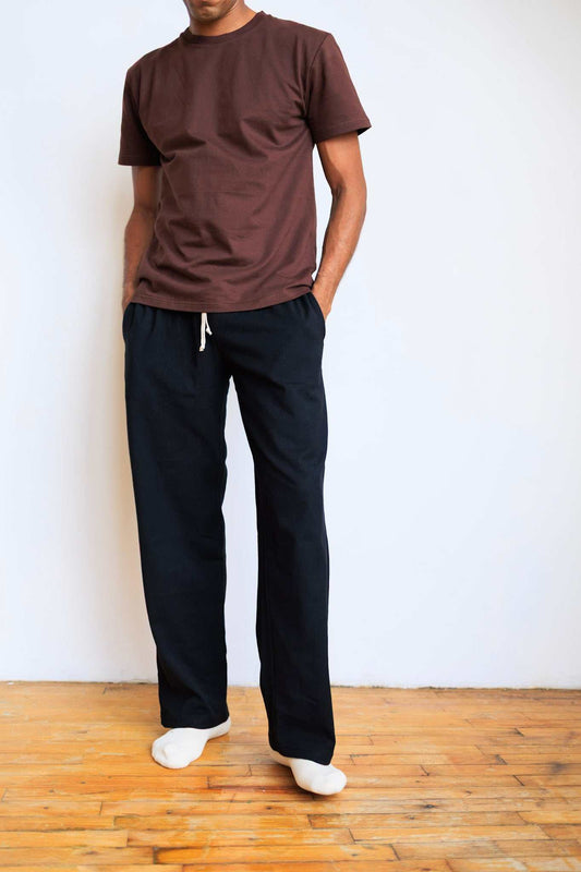 Unisex eco-friendly hemp organic cotton lounge pants with elastic waist and side pockets in blue, black, and gray colors