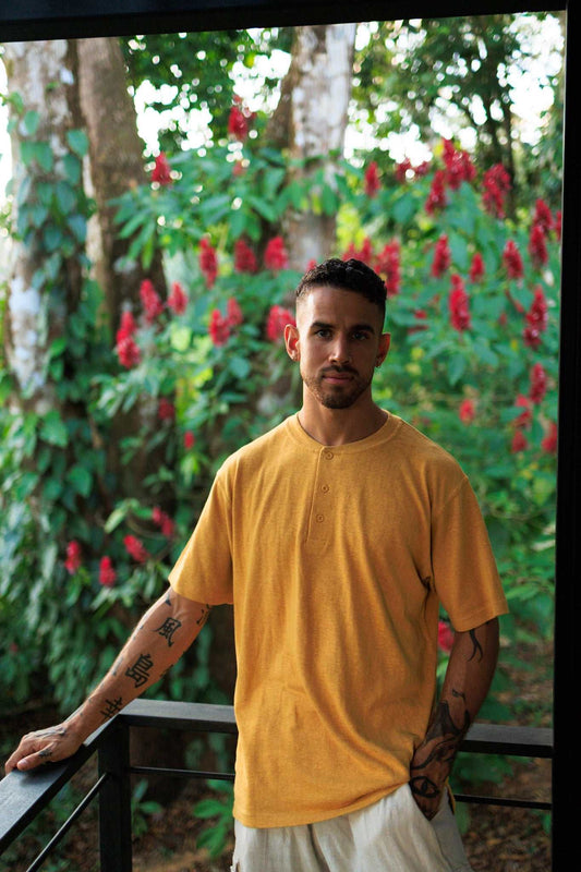 Mustard yellow hemp and organic cotton blend henley shirt with 3-button neckline and relaxed fit for breathable summer wear