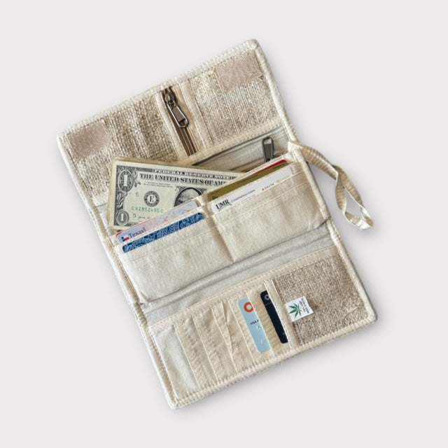 Hemp wallet with floral embroidery, multiple compartments, and card slots, made from sustainable materials.