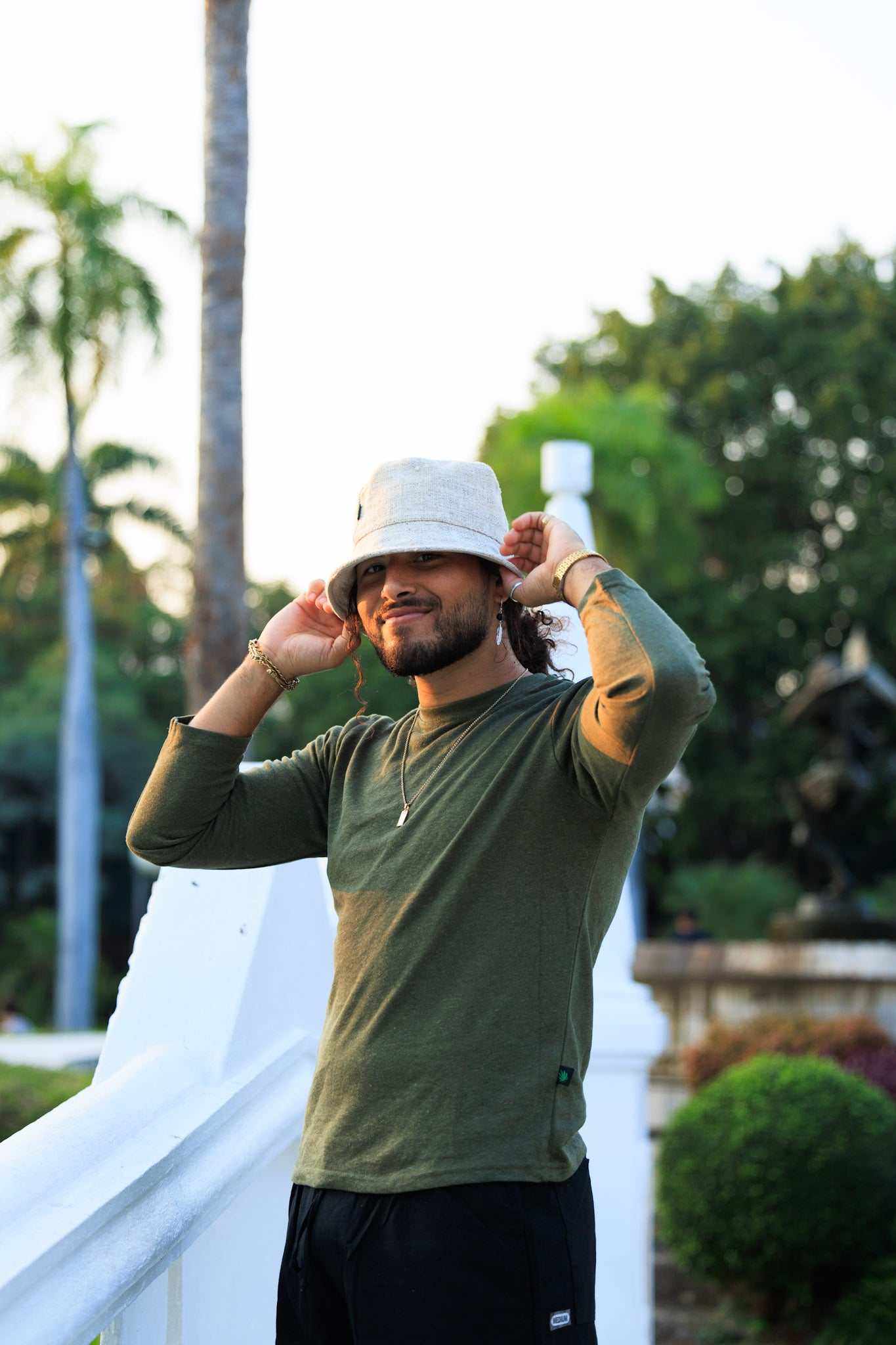 Eco-friendly hemp bucket hat in natural color worn by a person outdoors.