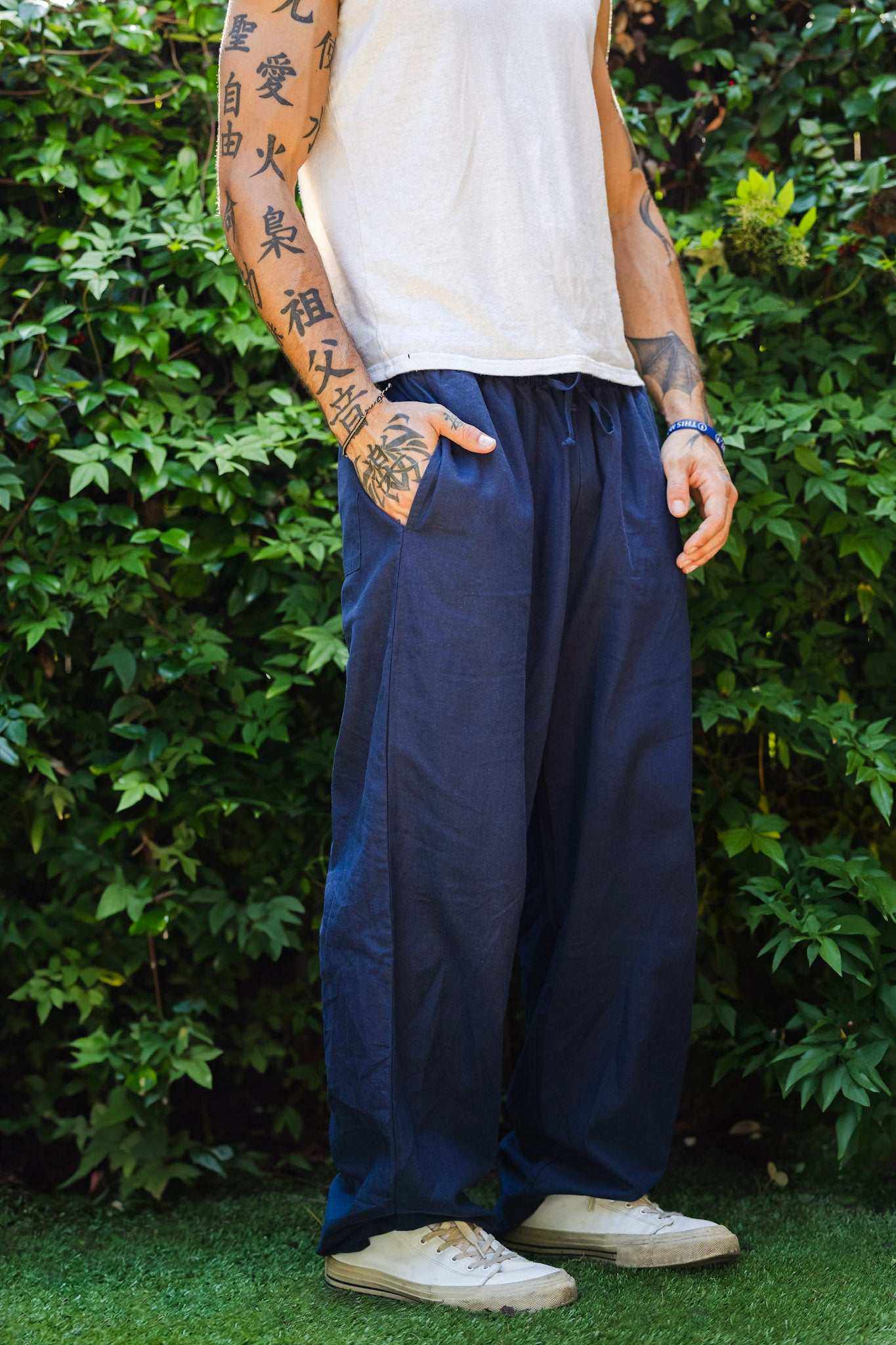 Unisex hemp linen and organic cotton pants in navy blue, relaxed fit, eco-friendly material, suitable for casual wear and activities.