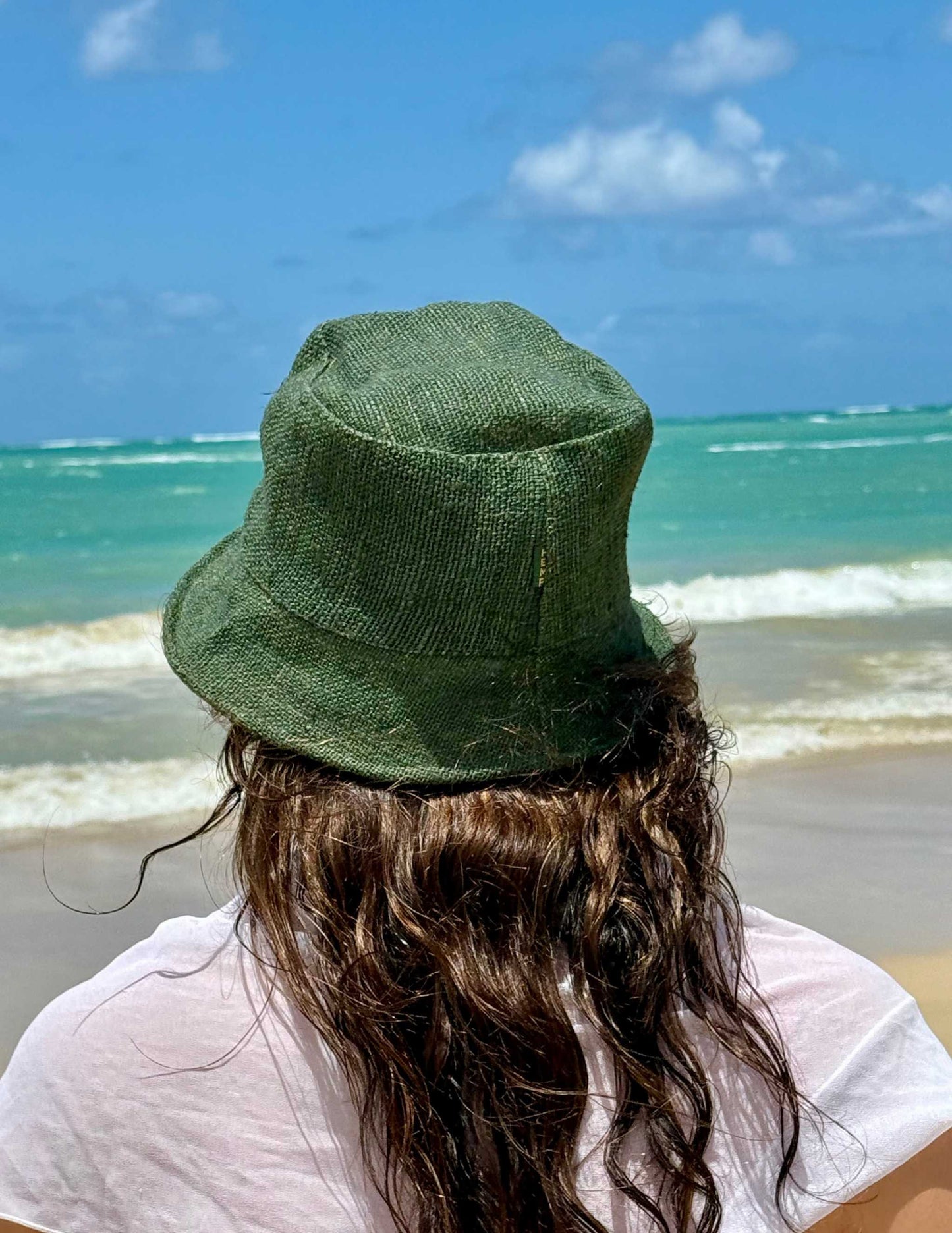 Hemp bucket hat in olive color, unisex sizing, eco-friendly and lightweight for beach or casual wear.