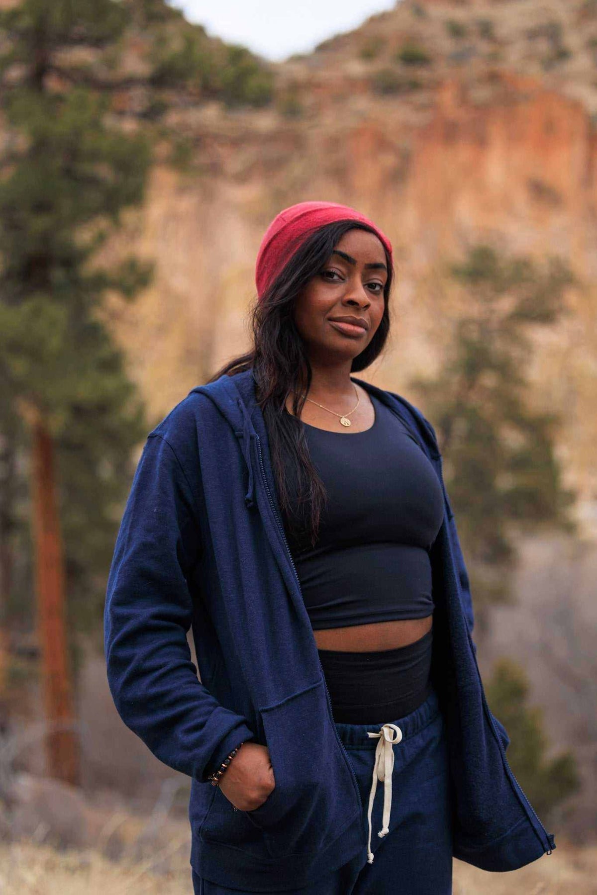 Hemp Hoodie in navy blue with a soft, solid fabric, open front, drawstring waist, and relaxed fit