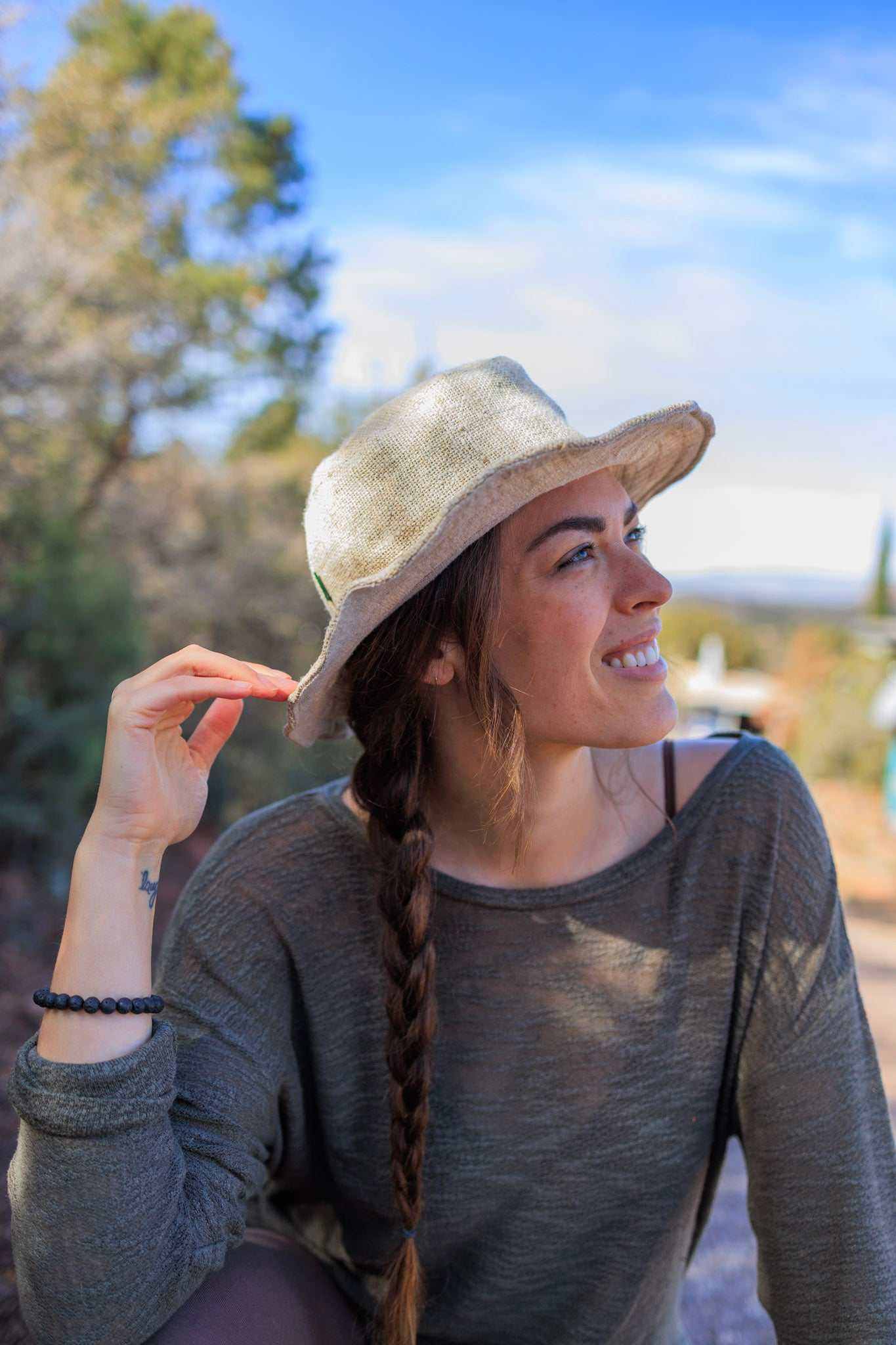 Handmade natural hemp sun hat with wide wire brim in olive green and natural colors, packable and breathable for summer travel