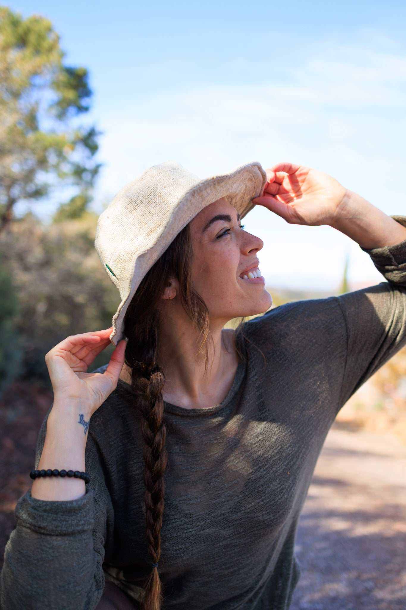 Handmade natural hemp hat in use outdoors, showcasing unisex design and eco-friendly material.