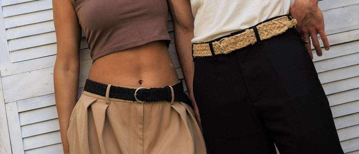 Rasta Belt woven from natural hemp, shown in black and tan colorways with textured fibers and metal buckles