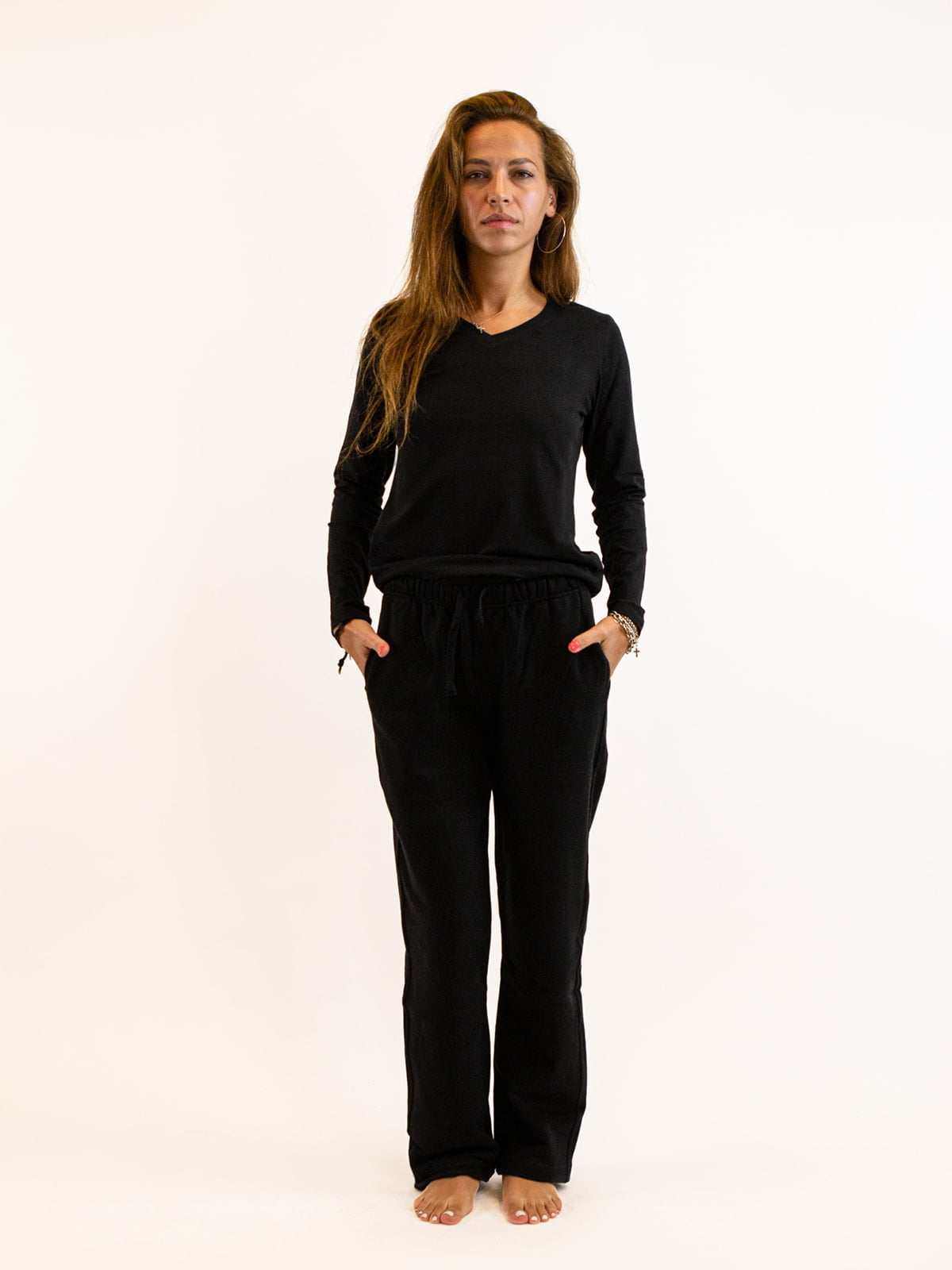 Woman wearing a black outfit on a white background