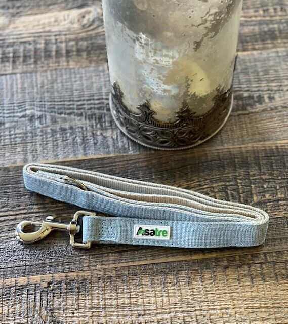 Denim blue hemp cotton dog leash with metal hook and welded D-ring on wooden surface