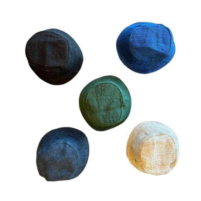 Solid color hemp bucket hats in black, blue, navy, olive, and natural options.