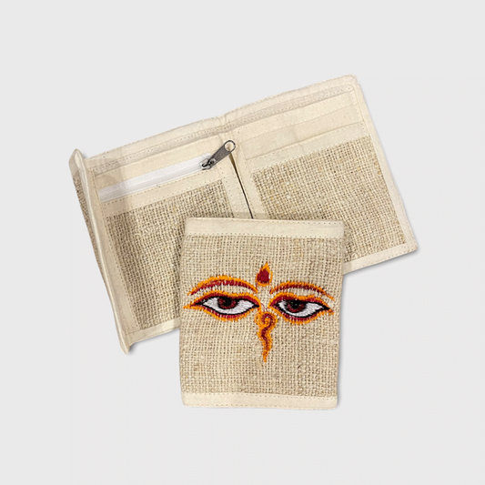 Eco-friendly hemp bi-fold wallet with embroidered Buddha Eyes, handmade in Nepal, featuring zipper and card slots