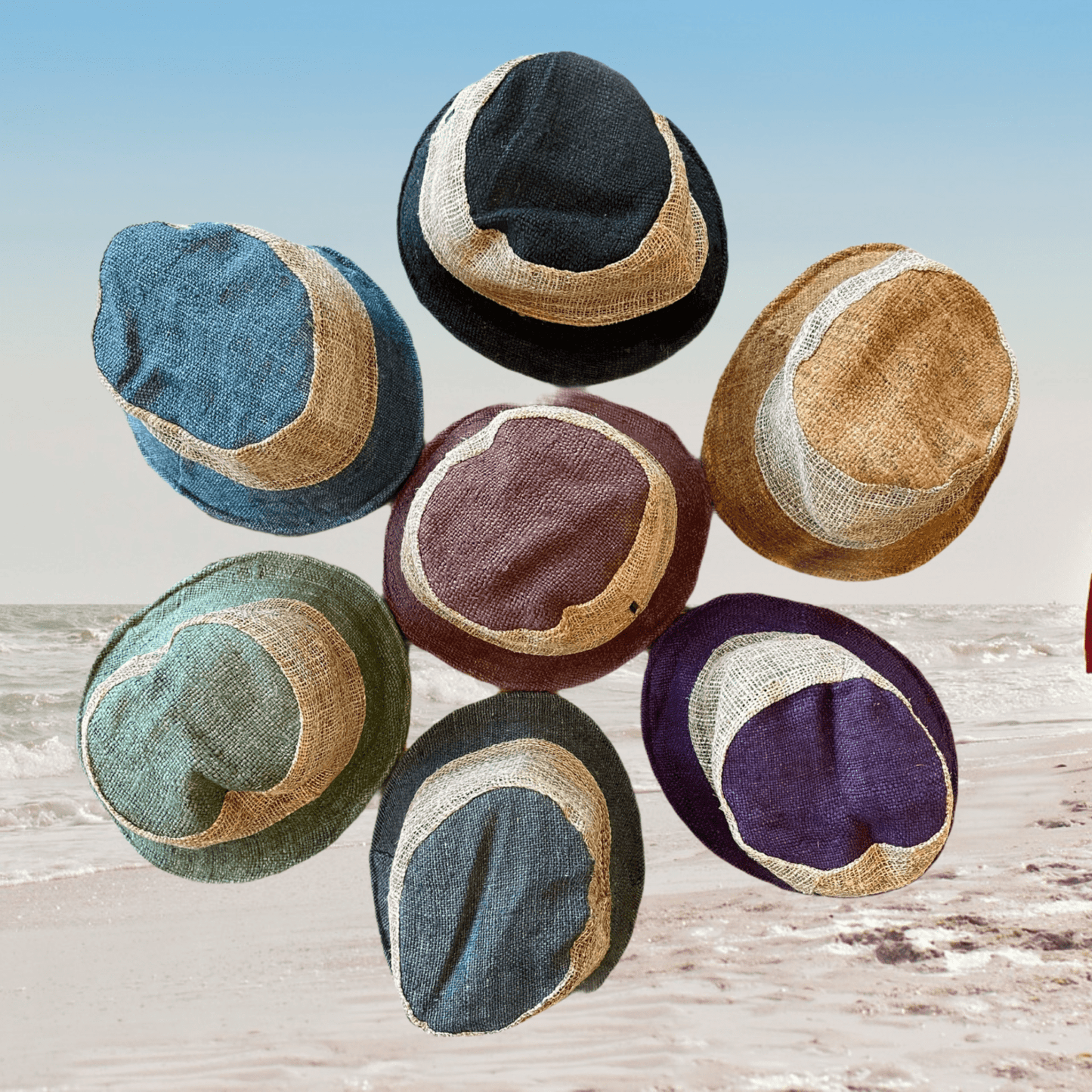 Hemp bucket hats in various colors on a beach backdrop.