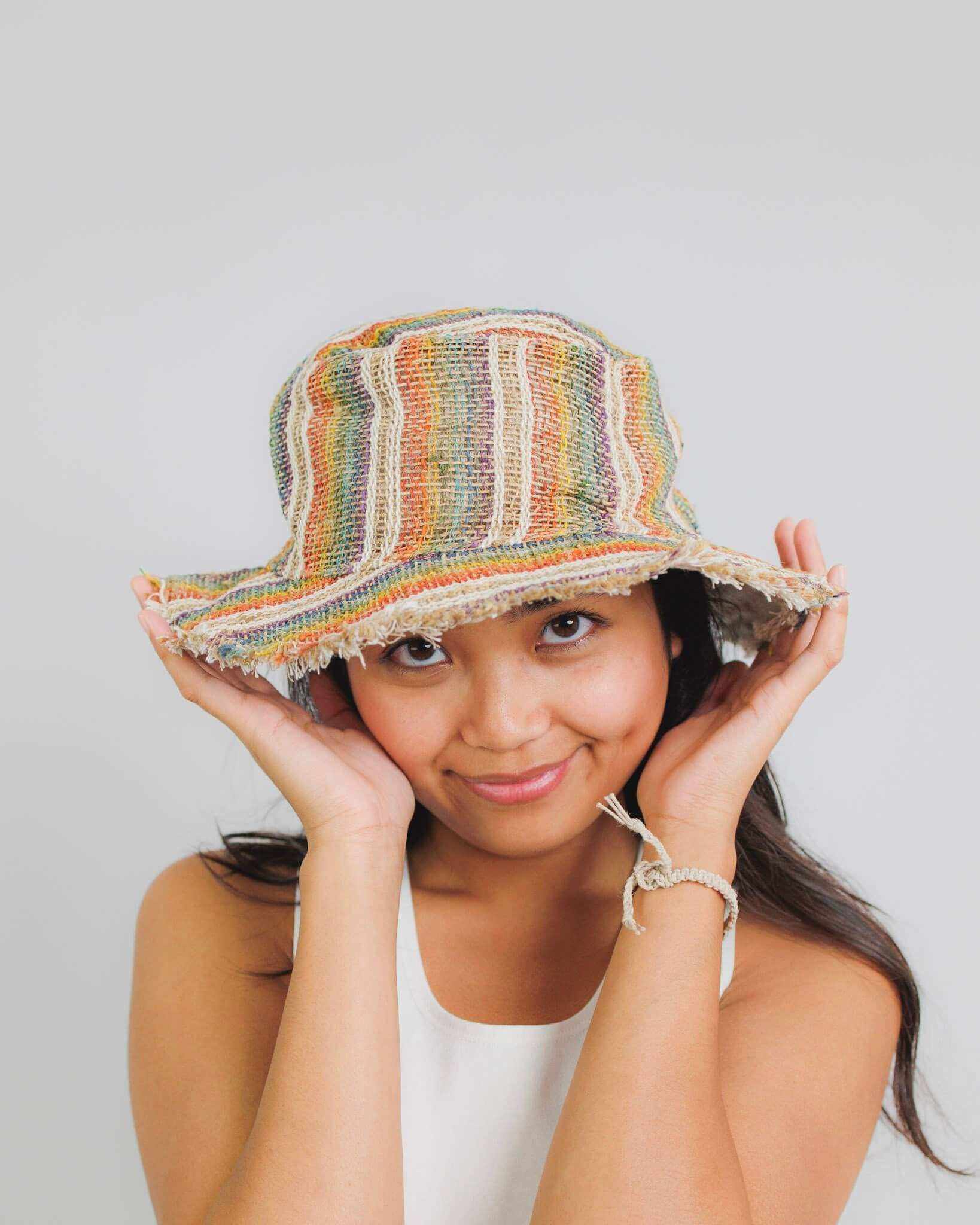 Hemp sun hat with rainbow stripes, ideal for beach and outdoor activities, UV resistant, 100% hemp with cotton lining.