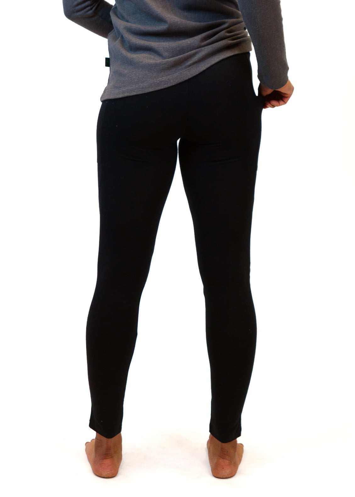 Black sustainable hemp and cotton leggings for women with functional side pockets, shown from the back.