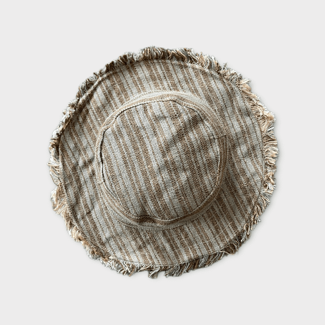 Hemp linen sun hat in neutral colors with a wide, wire brim for sun protection.