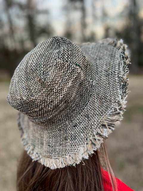 boho hemp beach sun hat black with wide brim and frayed edges worn outdoors