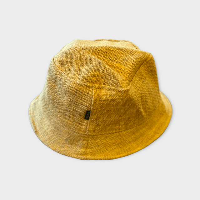 Hemp bucket hats in golden mustard on people at the beach.