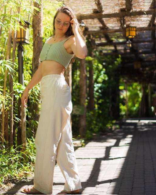 Unisex hemp linen and organic cotton pants in natural setting, showcasing breathable and eco-friendly design.