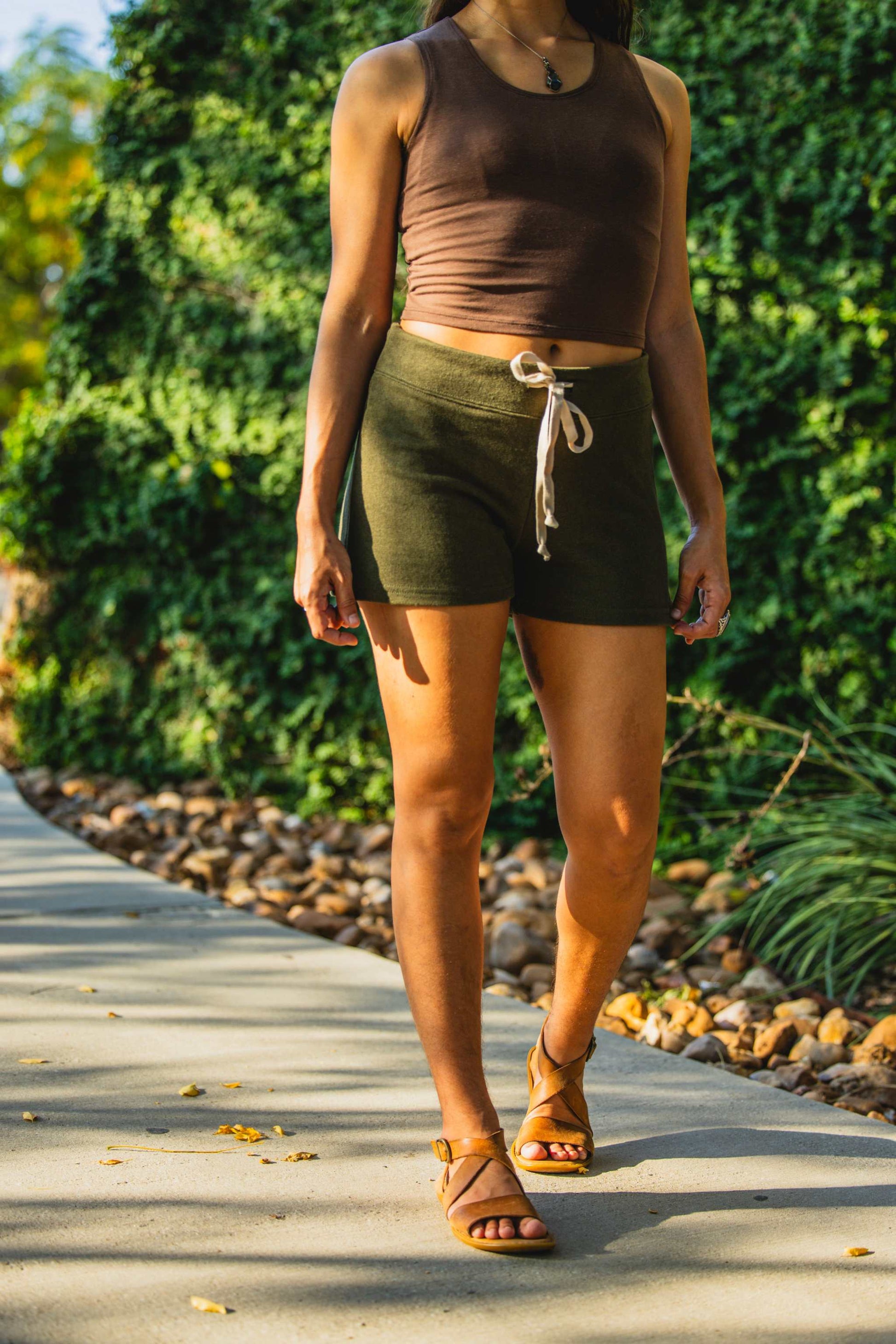 Women's hemp French terry drawstring shorts in olive color, elastic-free waistband, versatile for daily wear.
