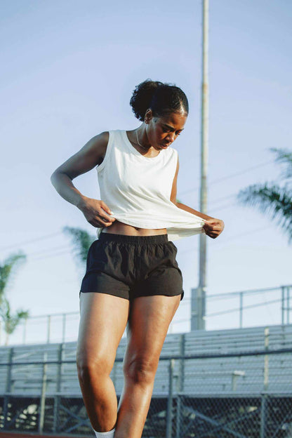 women wearing hemp running shorts in black and navy for active comfort