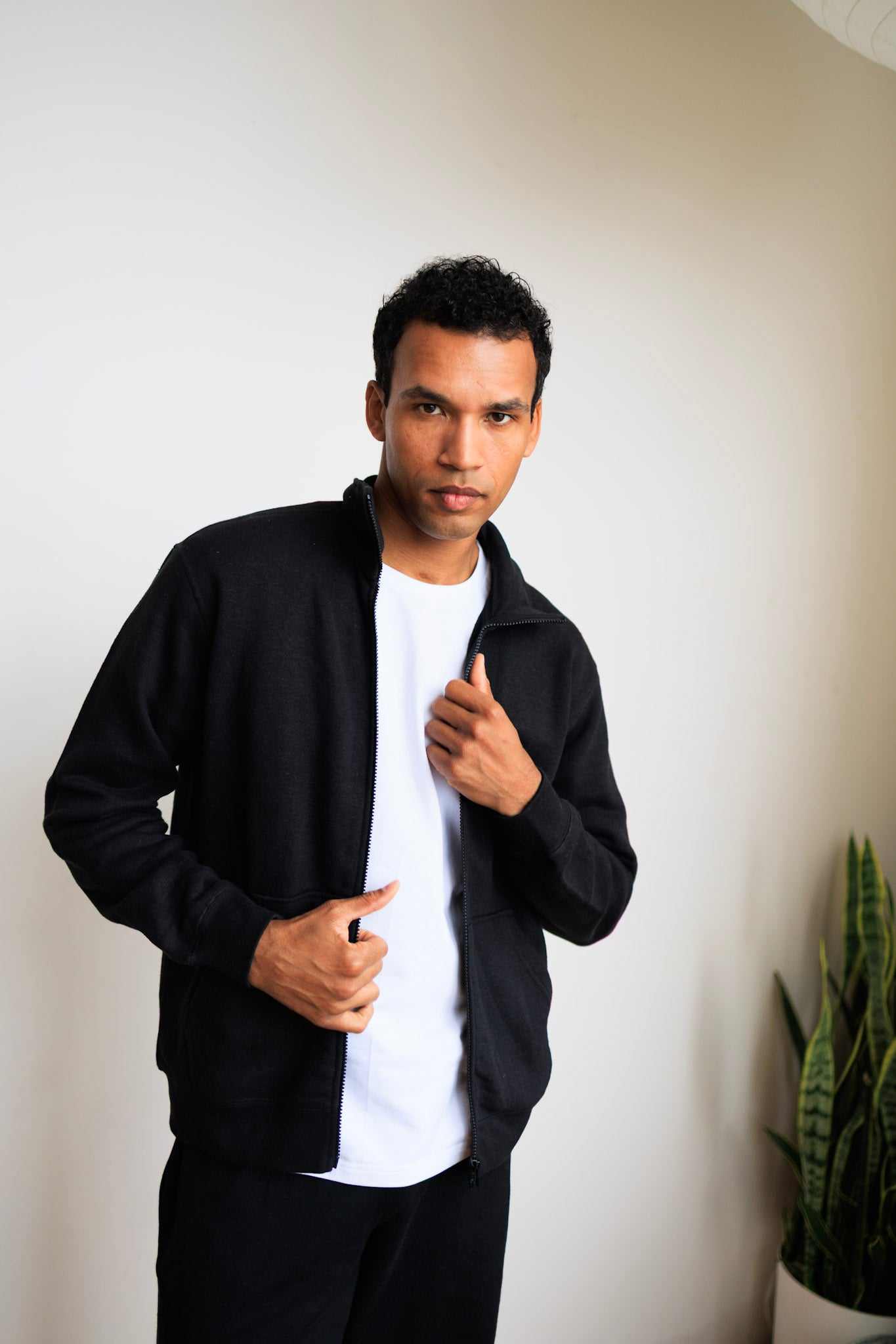 Eco-friendly hemp jacket made from organic cotton and hemp fleece, available in black and olive, featuring a full zipper and hand-warming pockets.