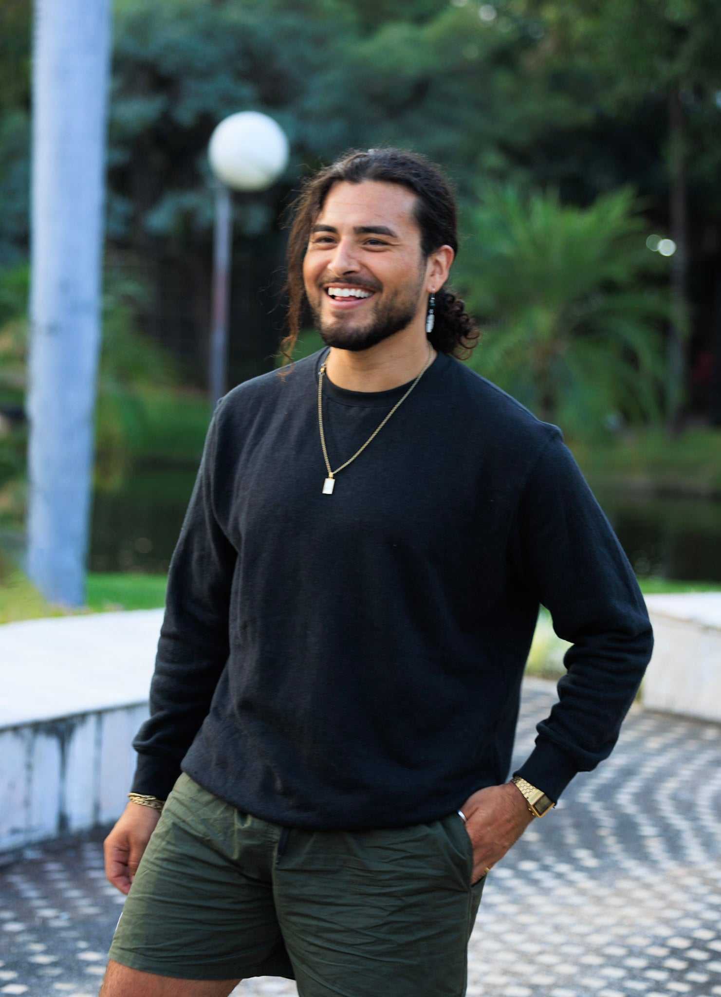 man wearing black hemp and organic cotton fleece crew sweatshirt outdoors