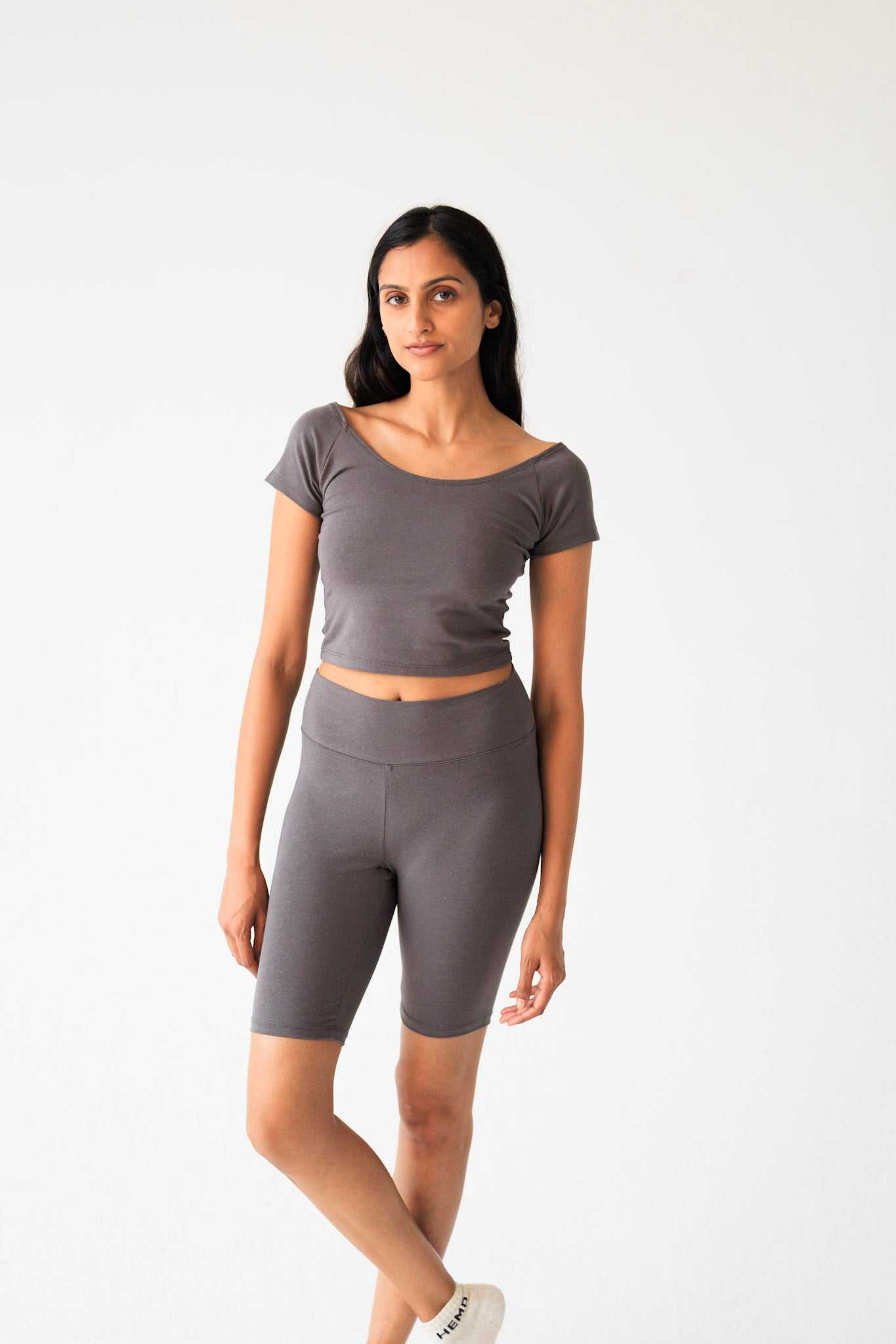 Woman wearing gray women's bike shorts made from lightweight hemp cotton blend, casual fit for everyday wear
