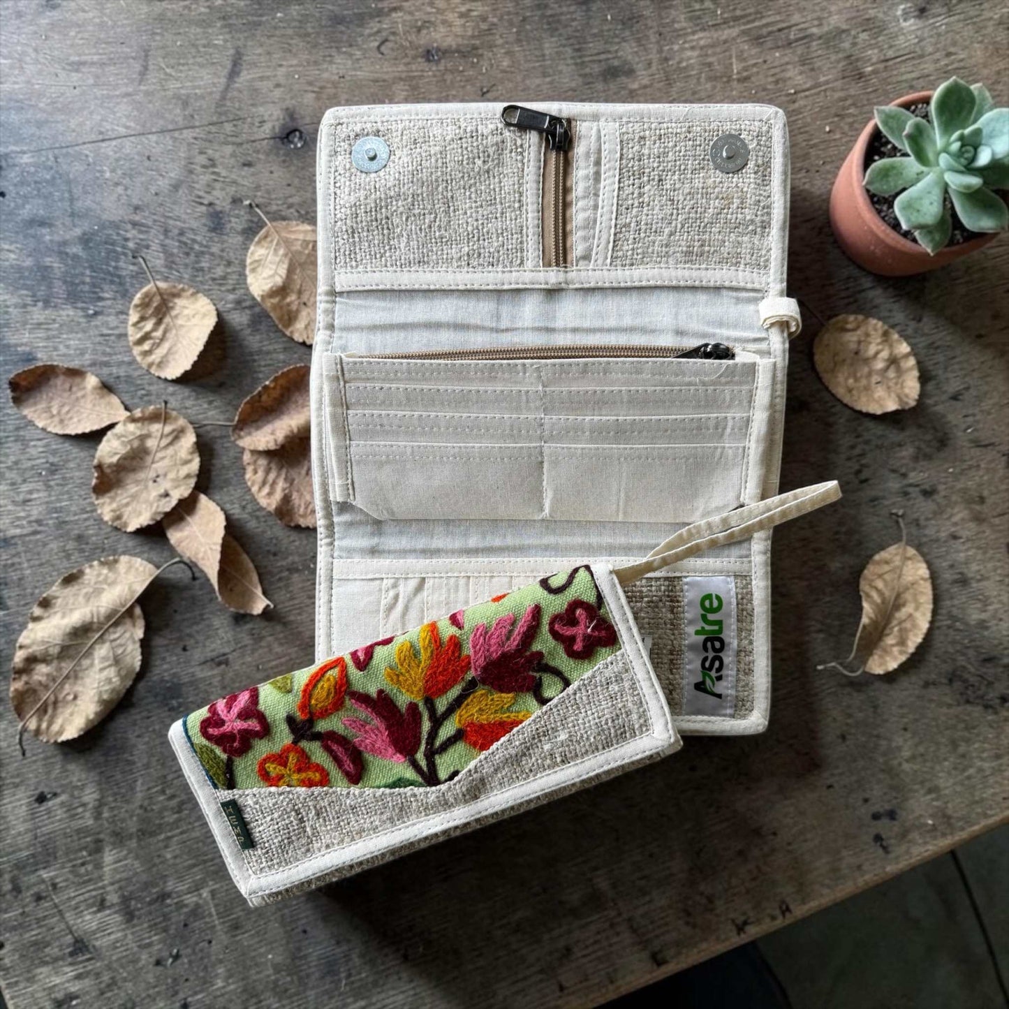 Handmade hemp wallet with embroidered floral design in tri-fold style, sustainable vegan bohemian accessory
