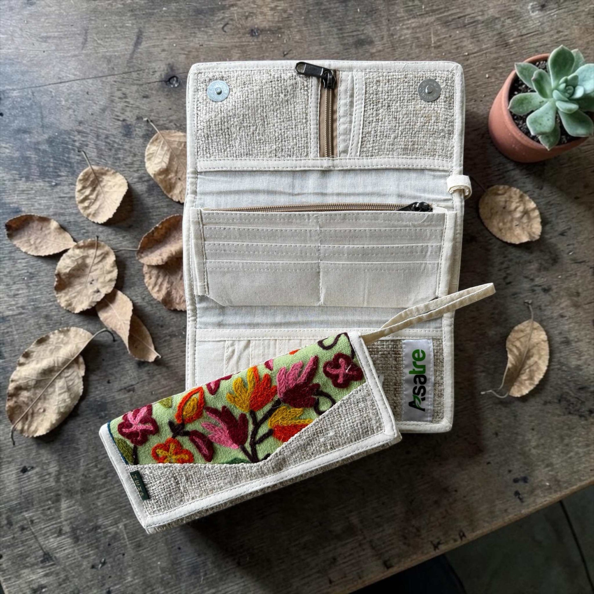 Handmade hemp wallet with embroidered floral design in tri-fold style, sustainable vegan bohemian accessory