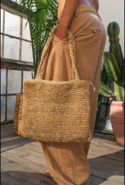 Handwoven hemp shoulder tote bag with braided straps in natural color, eco-friendly and handmade.