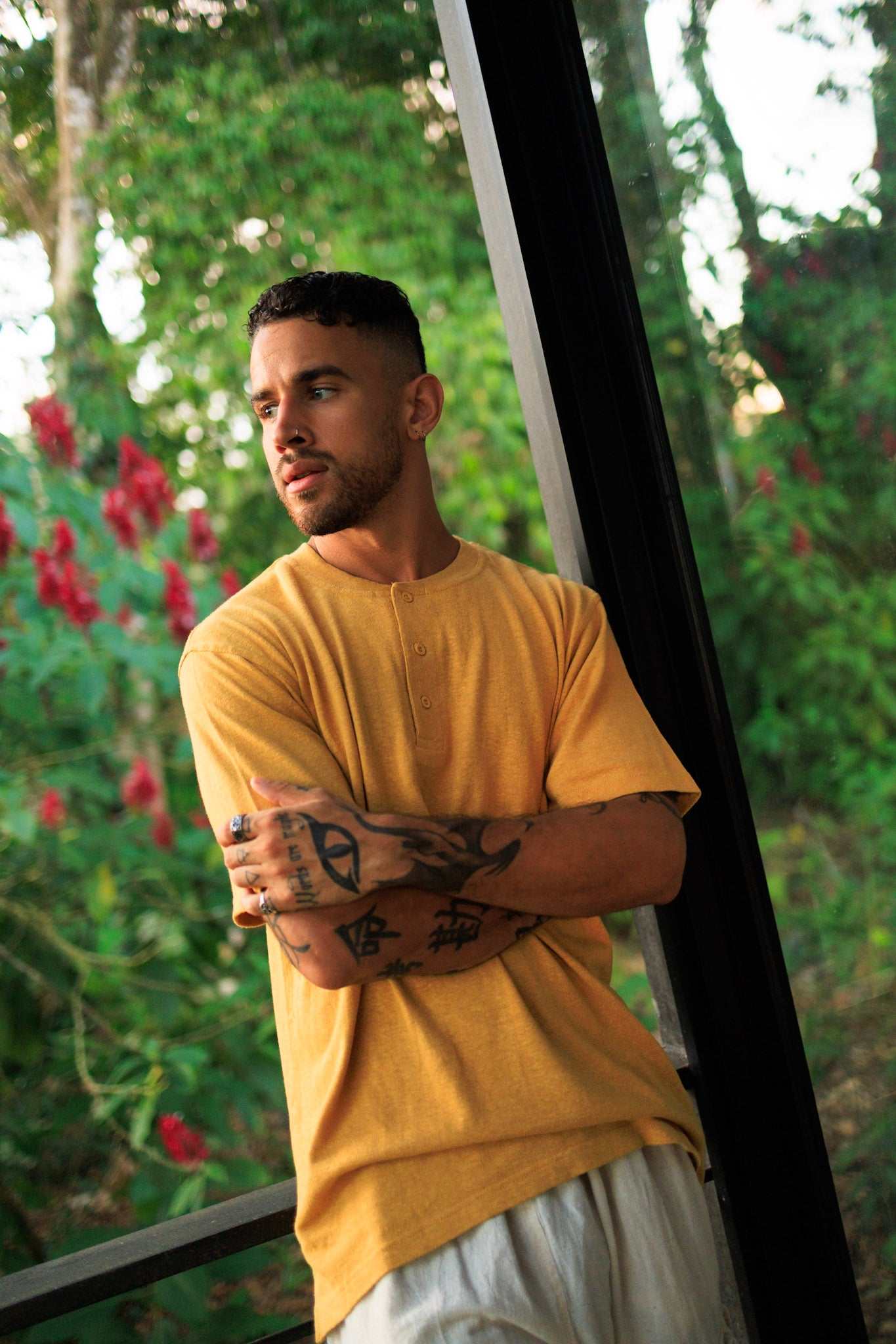 Mustard yellow hemp t-shirt with 3-button henley neckline and relaxed fit made from organic cotton blend