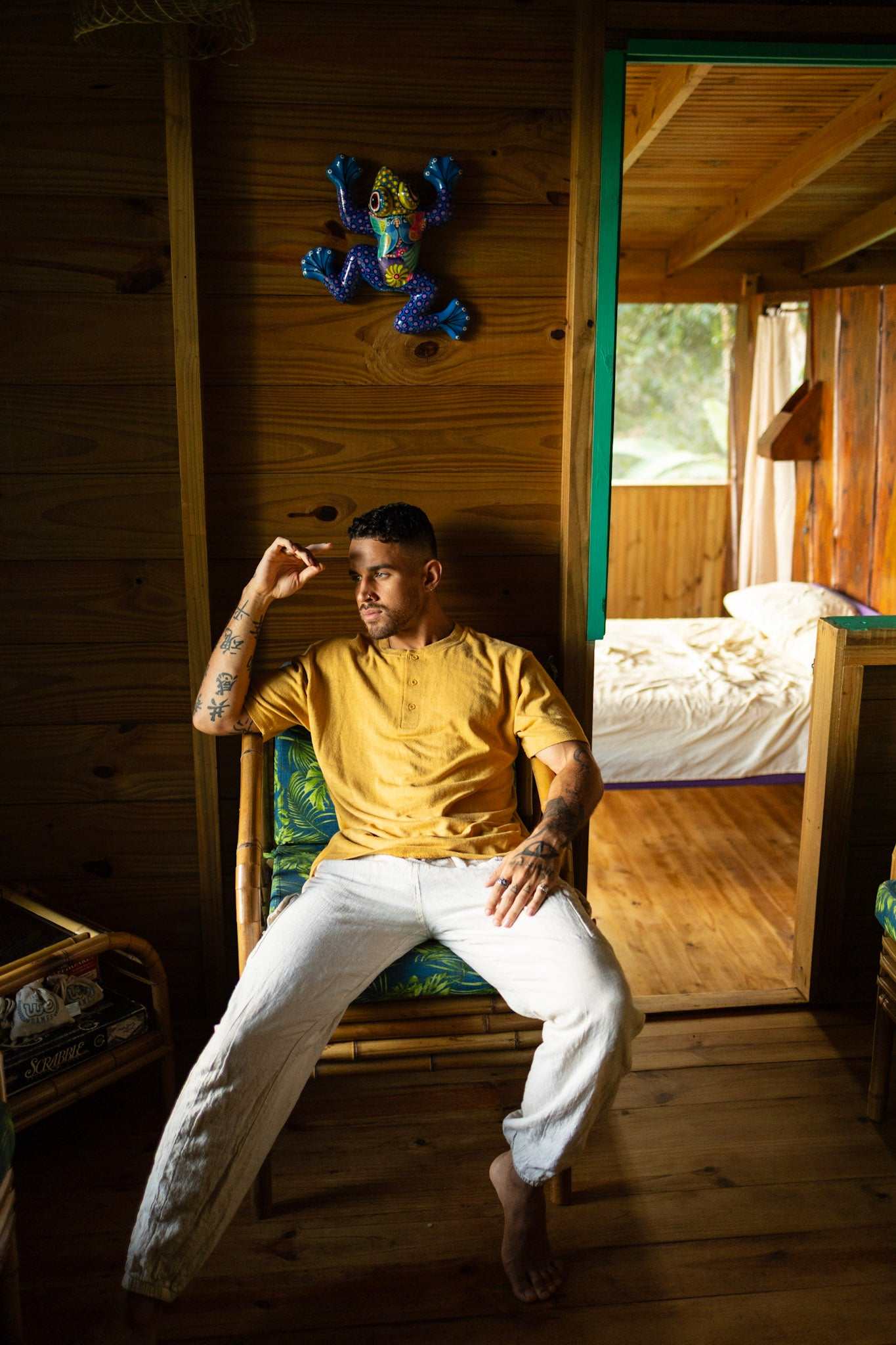 Mustard yellow hemp t-shirt with 3-button henley neckline, breathable organic cotton blend, lightweight and relaxed fit.