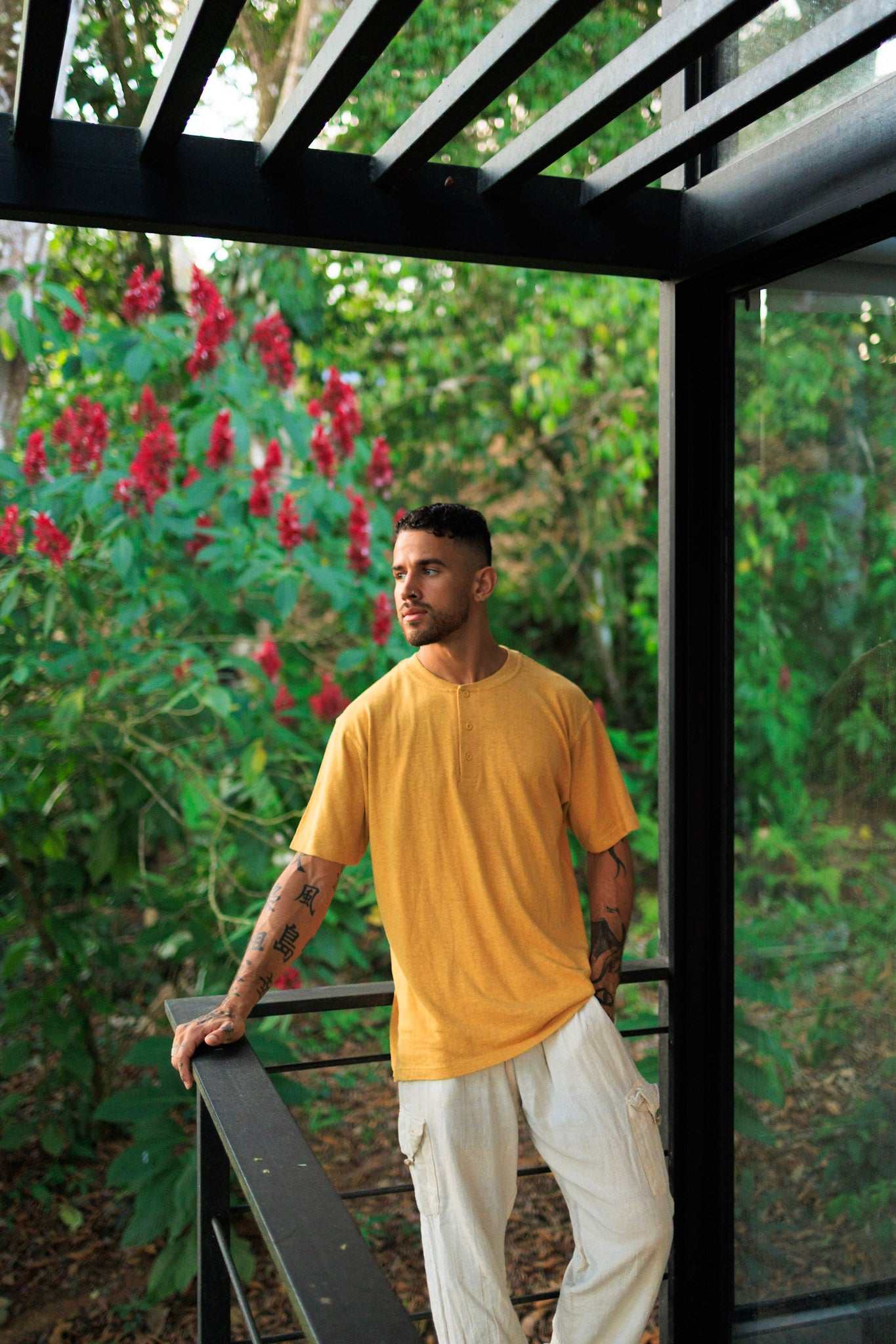 Mustard yellow hemp t-shirt with 3-button henley neckline, lightweight organic cotton blend, breathable and relaxed fit for sustainable summer wear