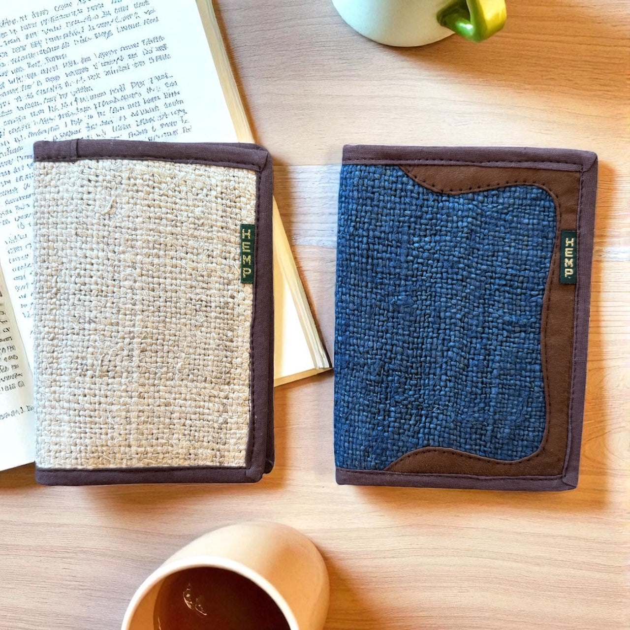 eco-friendly hemp passport covers with card slots in natural beige and navy blue colors on wooden table