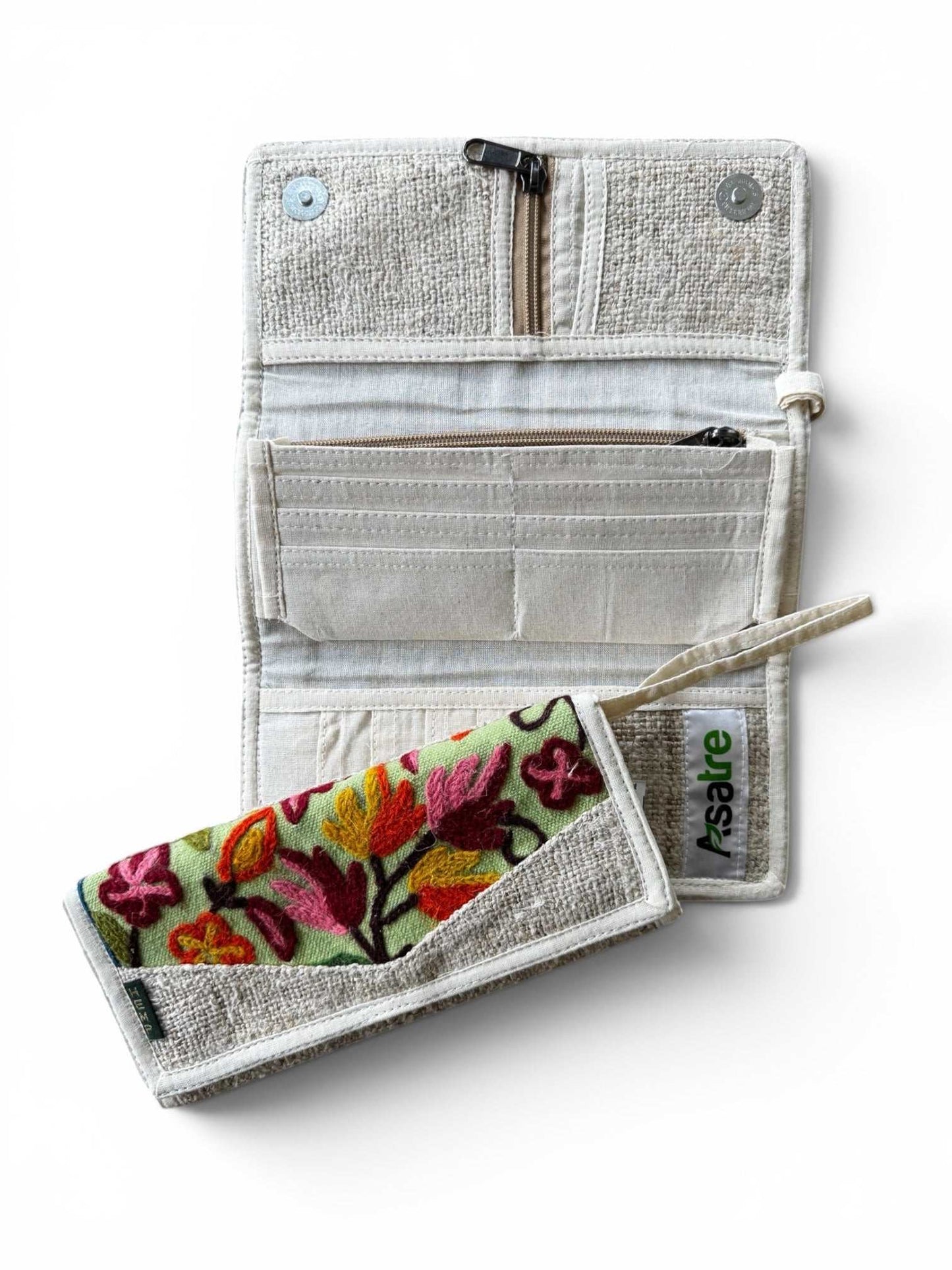 Handmade tri-fold hemp wallet with purple, pink, and green floral embroidery, sustainable vegan bohemian design