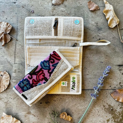 Handmade tri-fold hemp wallet with purple, pink, and green floral embroidery, sustainable vegan eco-friendly design