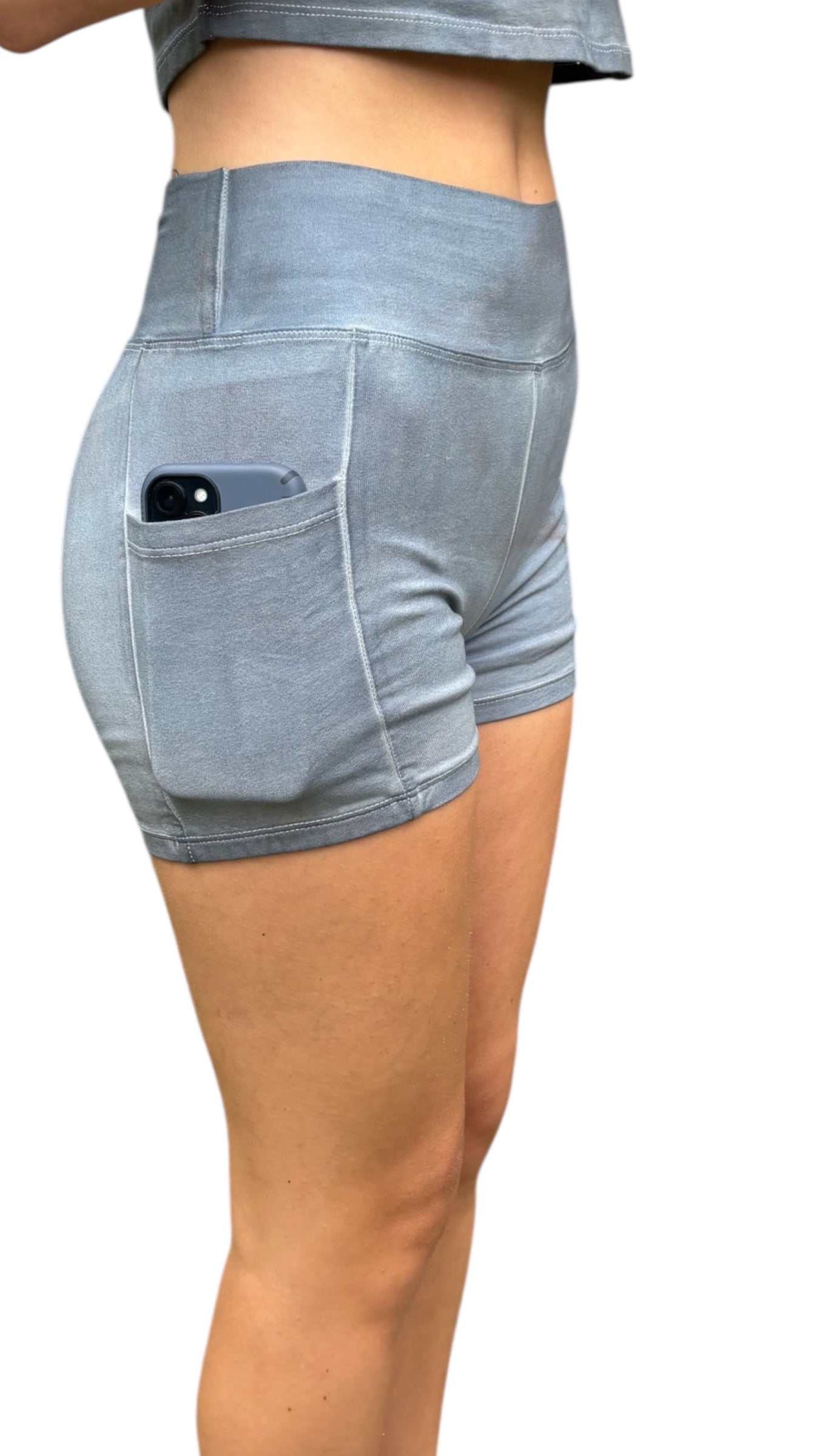 Light blue shorts with a pocket on a white background
