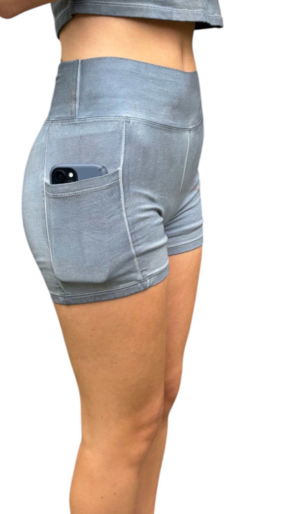 Light blue shorts with a pocket on a white background