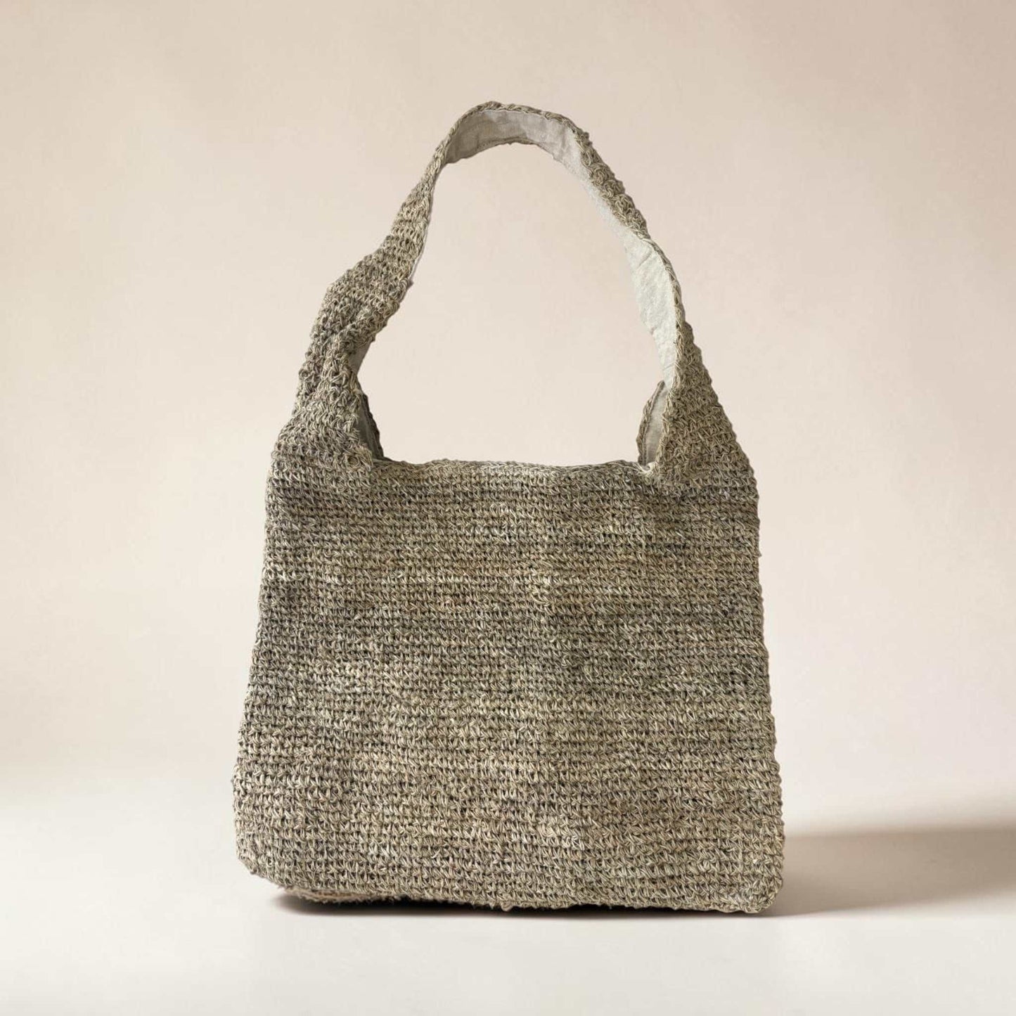 Handmade natural hemp shoulder bag with crochet design, zipper closure, and bohemian style for eco-friendly market shopping and travel