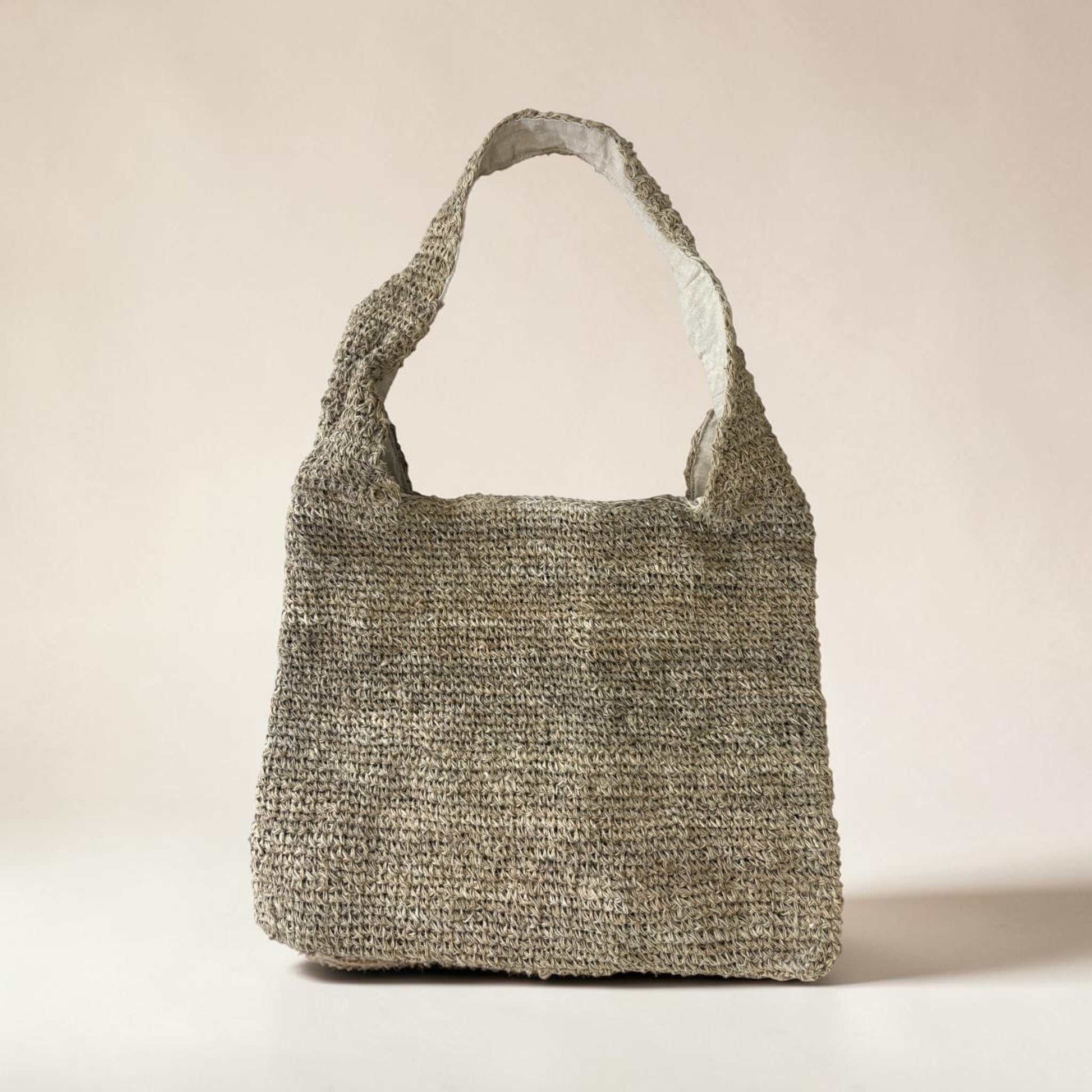 Handmade natural hemp shoulder bag with crochet design, zipper closure, and bohemian style for eco-friendly market shopping and travel