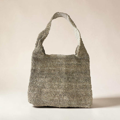 Handmade natural hemp shoulder bag with crochet design, zipper closure, and bohemian style for eco-friendly market shopping and travel