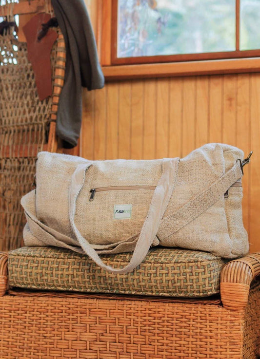 Eco-friendly hemp duffel bag on wicker chair for travel and gym use