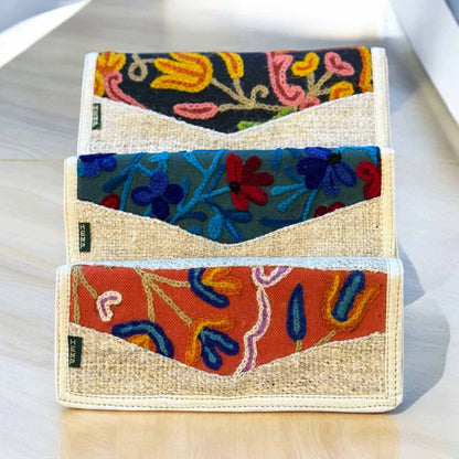 Women's hemp wallet with floral embroidery, vegan tri-fold design, multiple card slots, eco-friendly, handmade in Nepal.