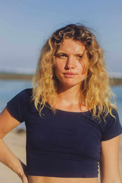 Cotton Crop Top in navy with short sleeves, a wide scoop neckline, and a fitted cropped hem