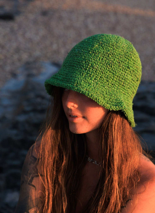 festival crochet hat in bright green textured crochet, with a rounded crown and soft, downturned brim