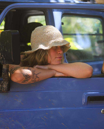 Hand-crocheted hemp floppy beach hat with wide brim and boho style